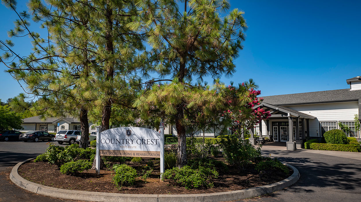 countrycrest-1250x700-1 The front of the Country Crest facility with the sign and trees