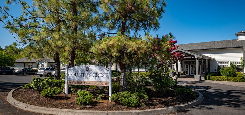 countrycrest-848x400-15 The front of the Country Crest facility with the sign and trees