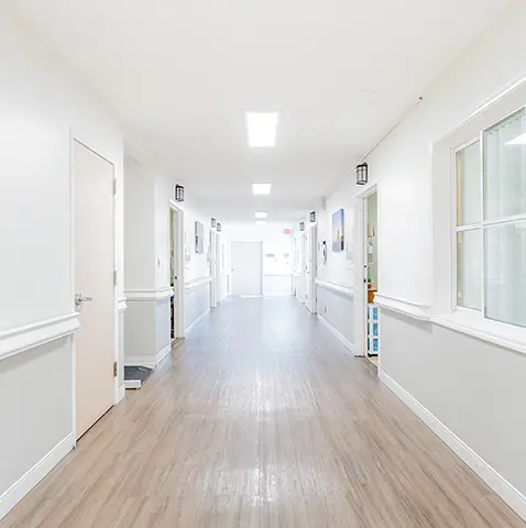 A long hallway with white walls