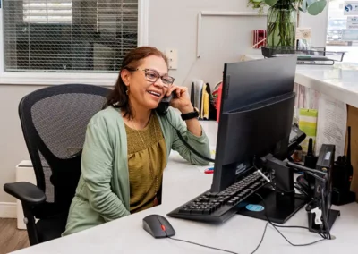 A receptionist answers the phone