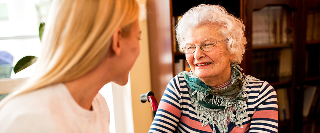 An elderly woman smiling