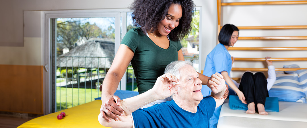 An elderly man doing physical therapy