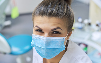 Nurse wearing a mask in a clinical setting